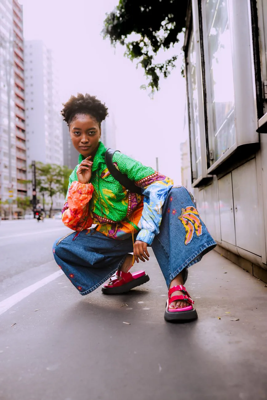 Model in colorful streetwear in an urban setting, in the social-first style Fashion Nova is known for