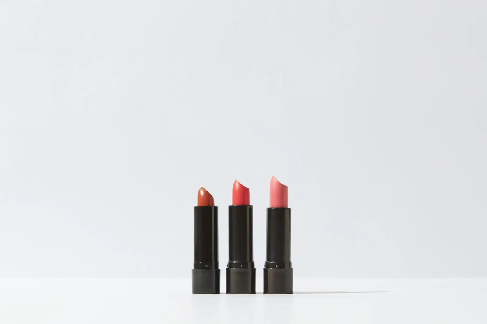 Lipsticks displayed on a clean white background, in the polished product style Kylie Cosmetics uses