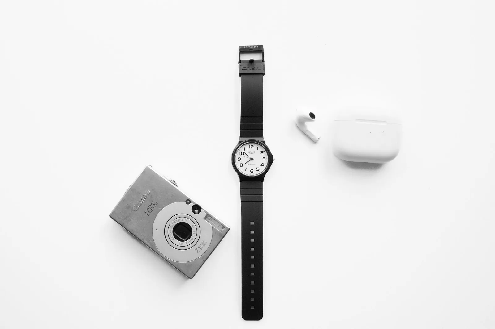 Minimalist watch and accessories on a clean white background, in MVMT's signature style