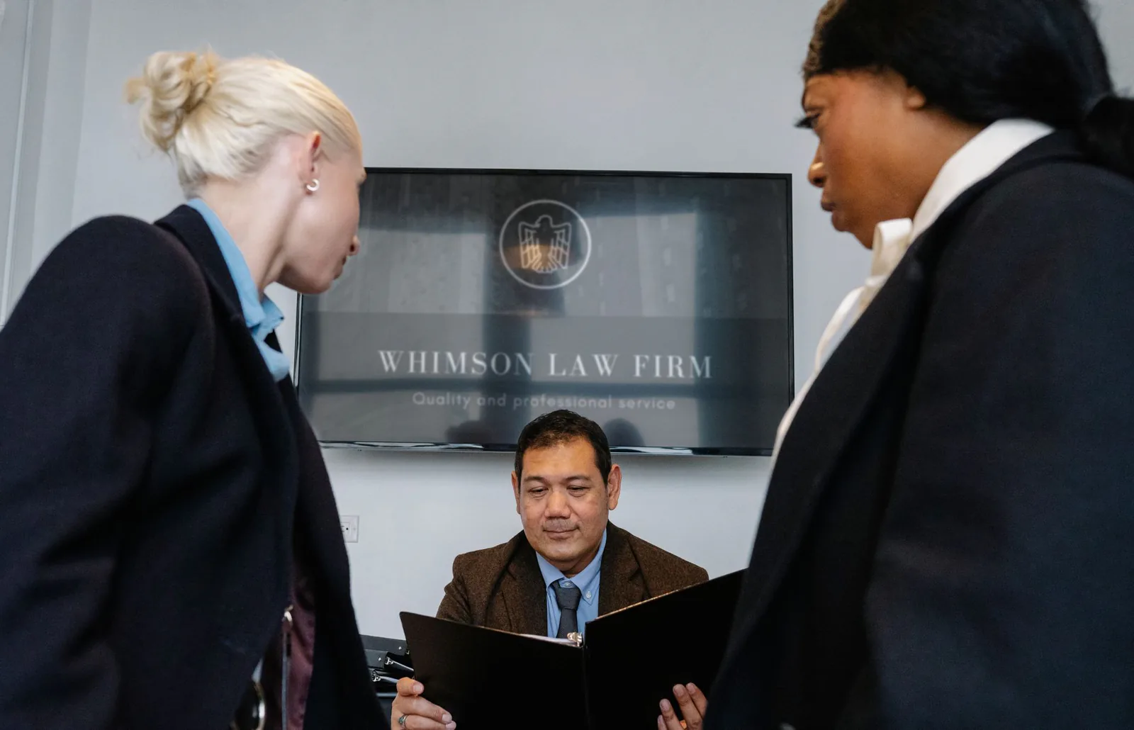 Law firm conference room with legal professionals