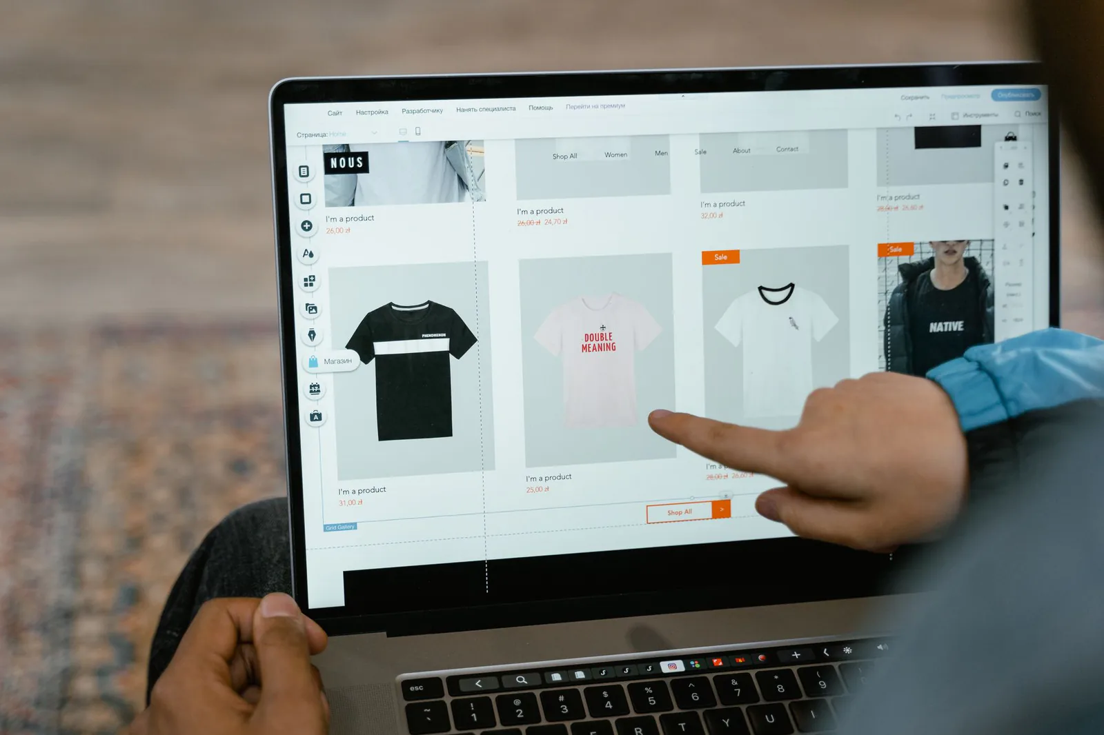 Small business owner comparing Wix alternatives on a laptop