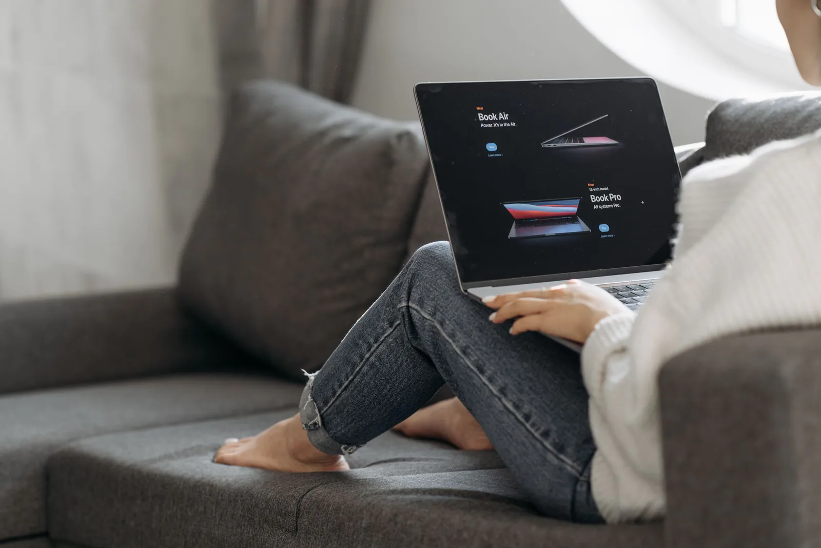 Business owner comparing WordPress and Webflow on a laptop