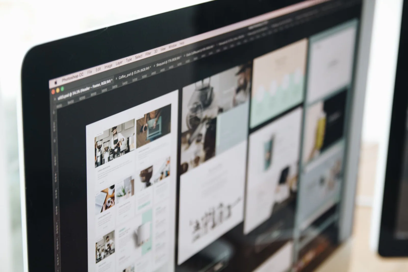 Web designer customizing a website layout on a desktop screen